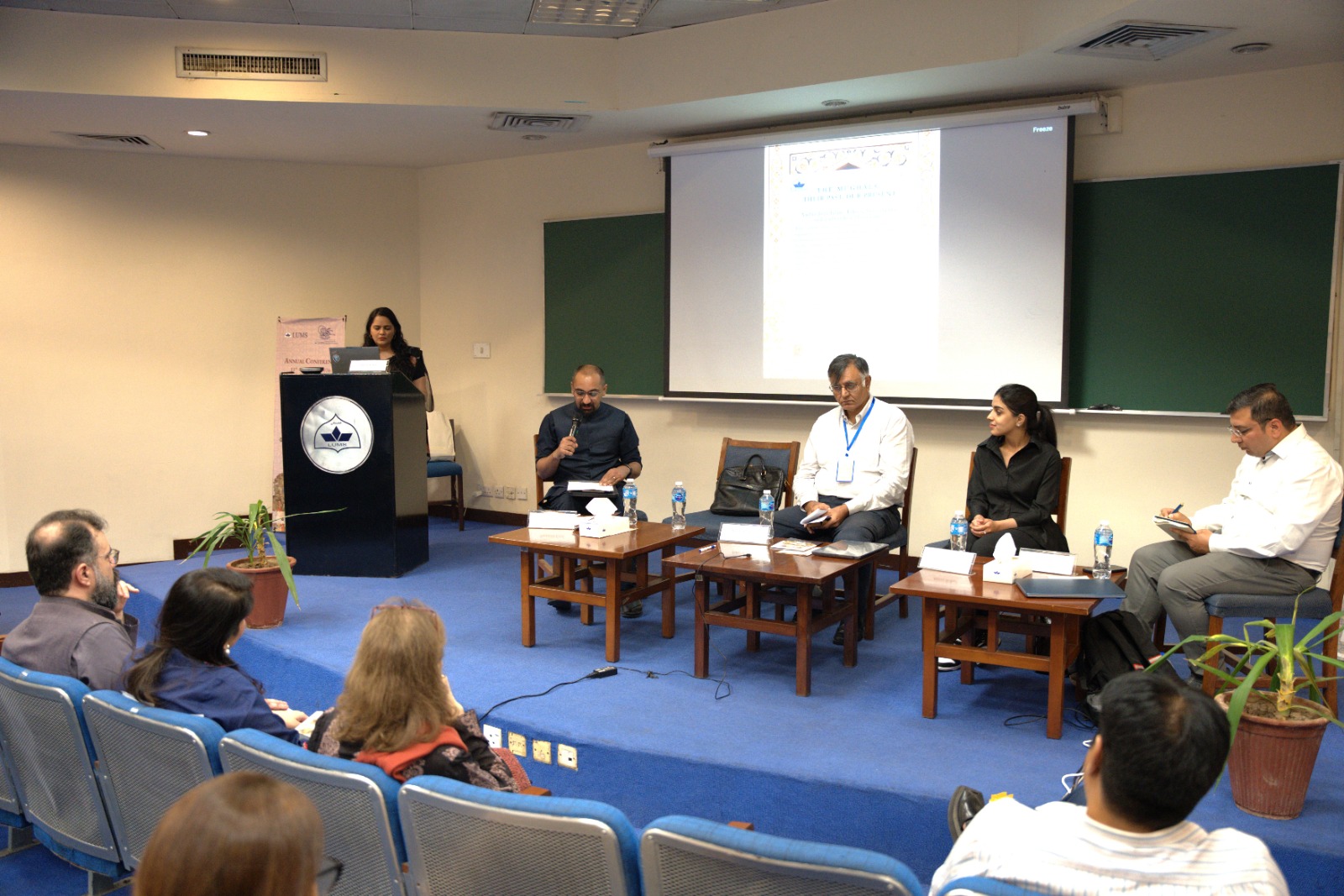 Scholars discussing the enduring legacy of the Mughal world at LUMS